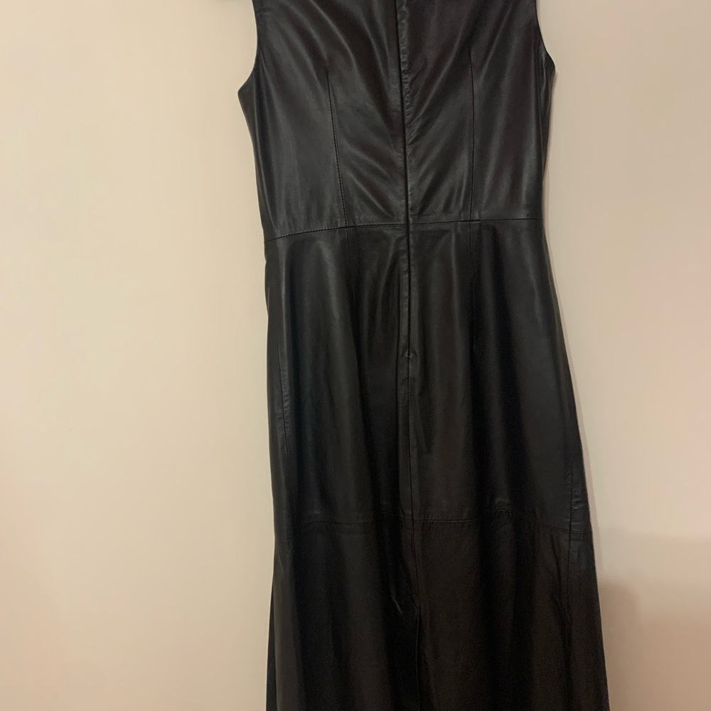 100% leather lamb skin sleeveless black dress made in Italy. Slit in back